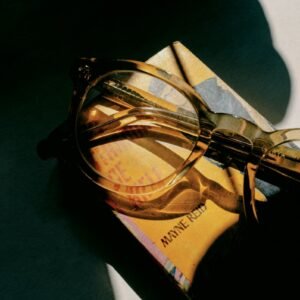 black framed eyeglasses on brown and black box